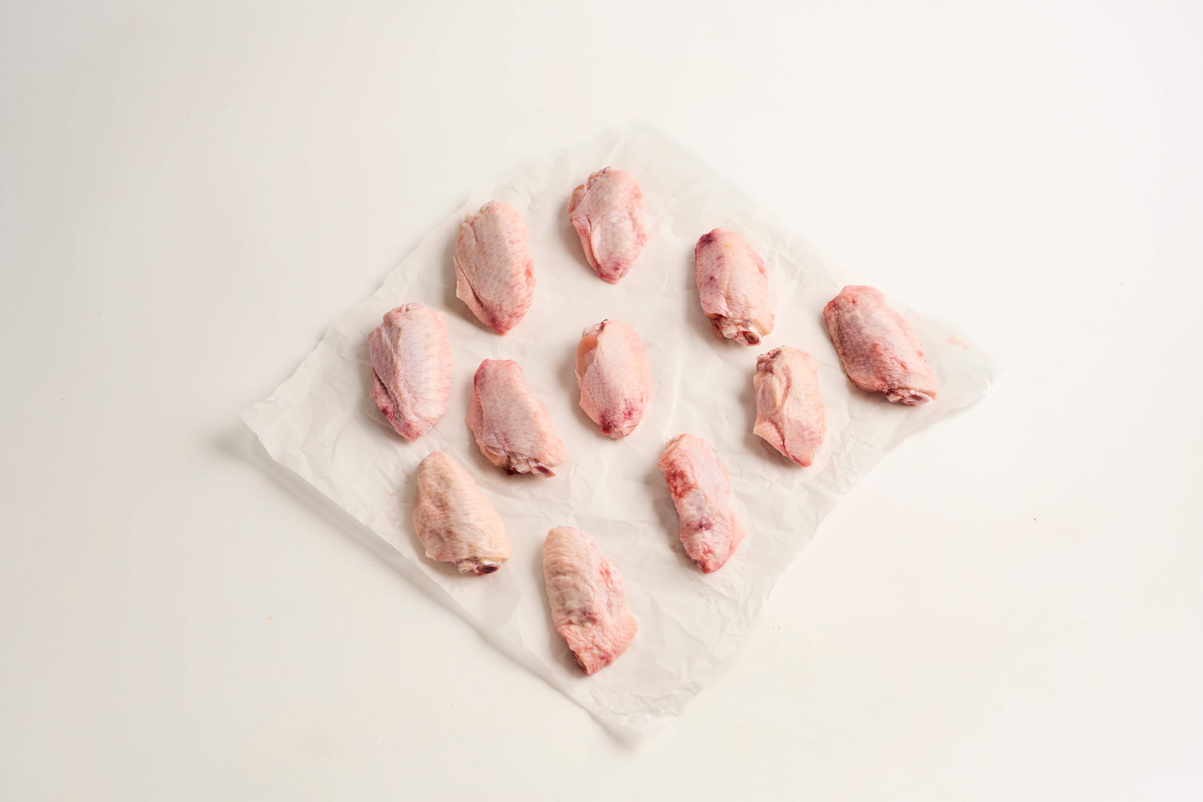 Meio das asas de frango congelado 600g